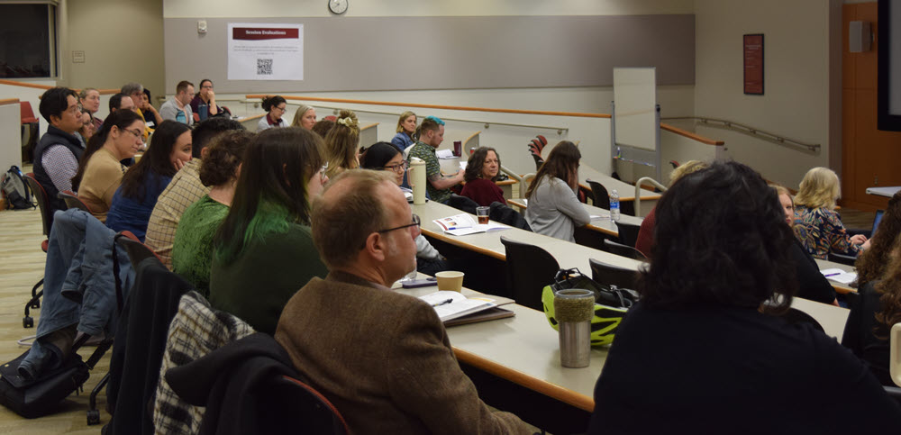Classroom auditorium full of staff and faculty for Teaching and Learning Conference.