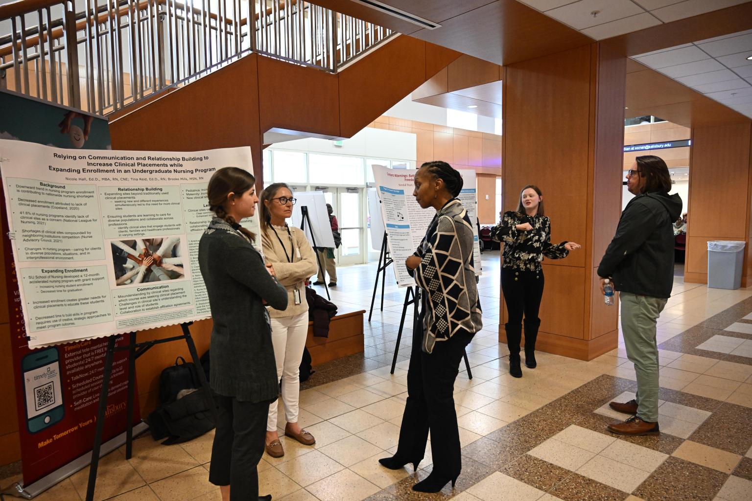 Attendees at TLC session in Perdue Hall during poster session