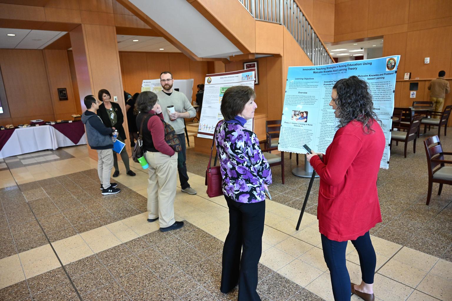 Attendees at TLC session in Perdue Hall during poster session