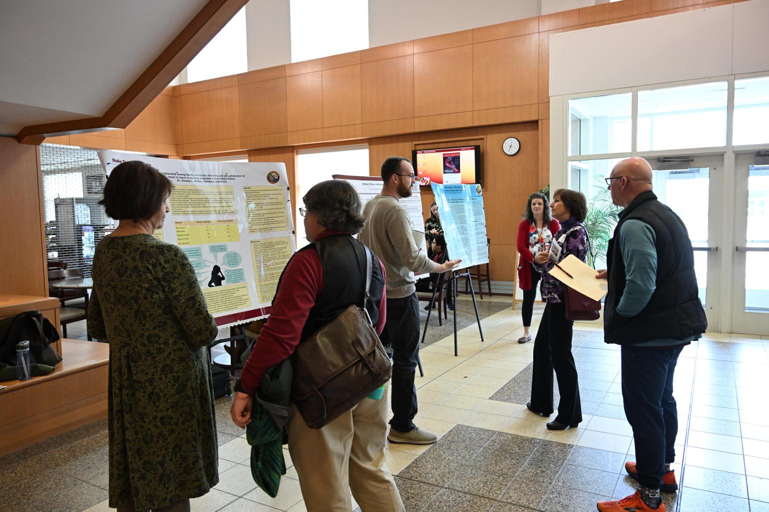 Attendees at TLC session in Perdue Hall during poster session