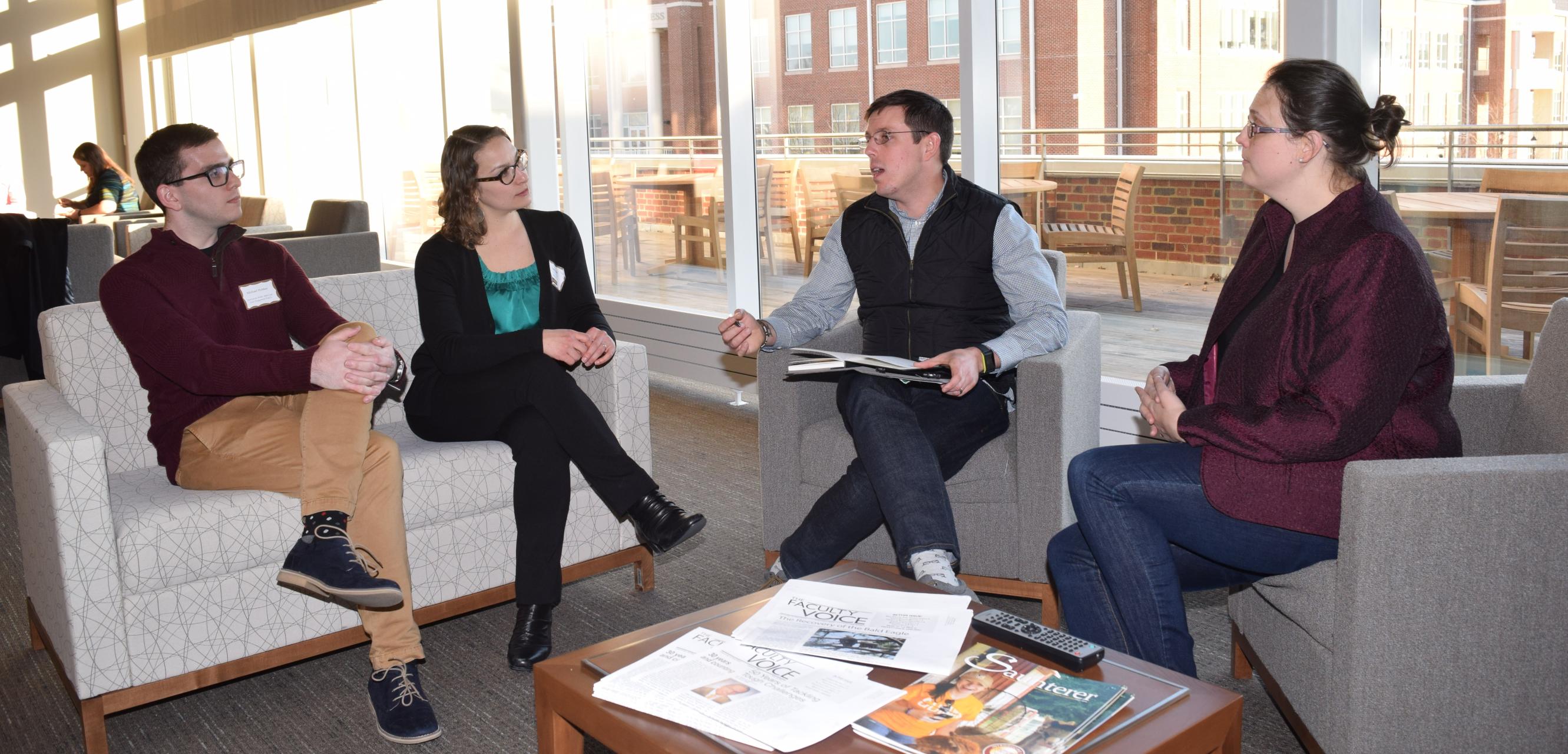 Faculty at SU discuss pedagogy and teaching strategies during a professional development event.