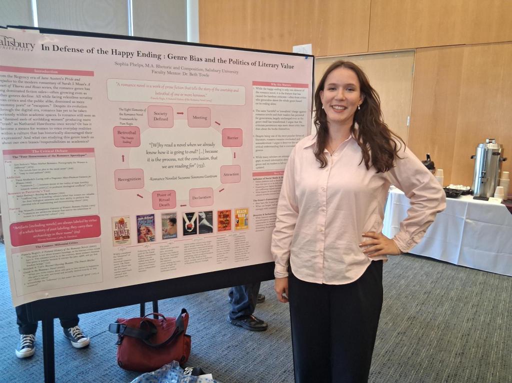 Sophia Phelps in front of research poster presentation.